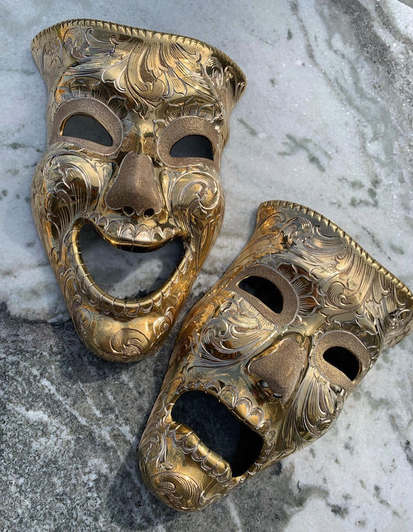 Pair of gold-engraved comedy and tragedy theatre masks