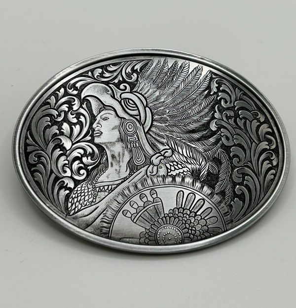 Engraved silver belt buckle depicting an Aztec warrior and woman