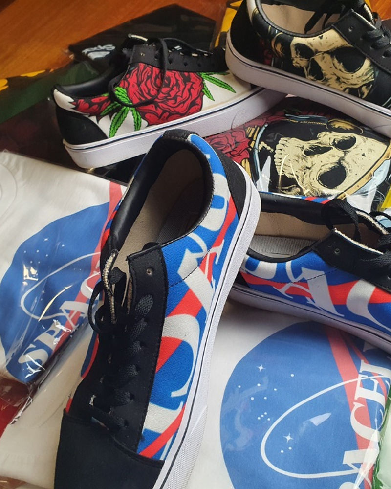 Spacely-branded sneakers laid out on floral fabric