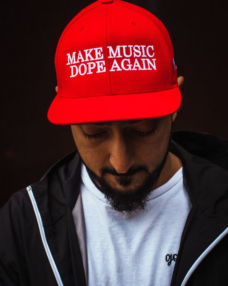 Red Spacely cap reading Make Music Dope Again