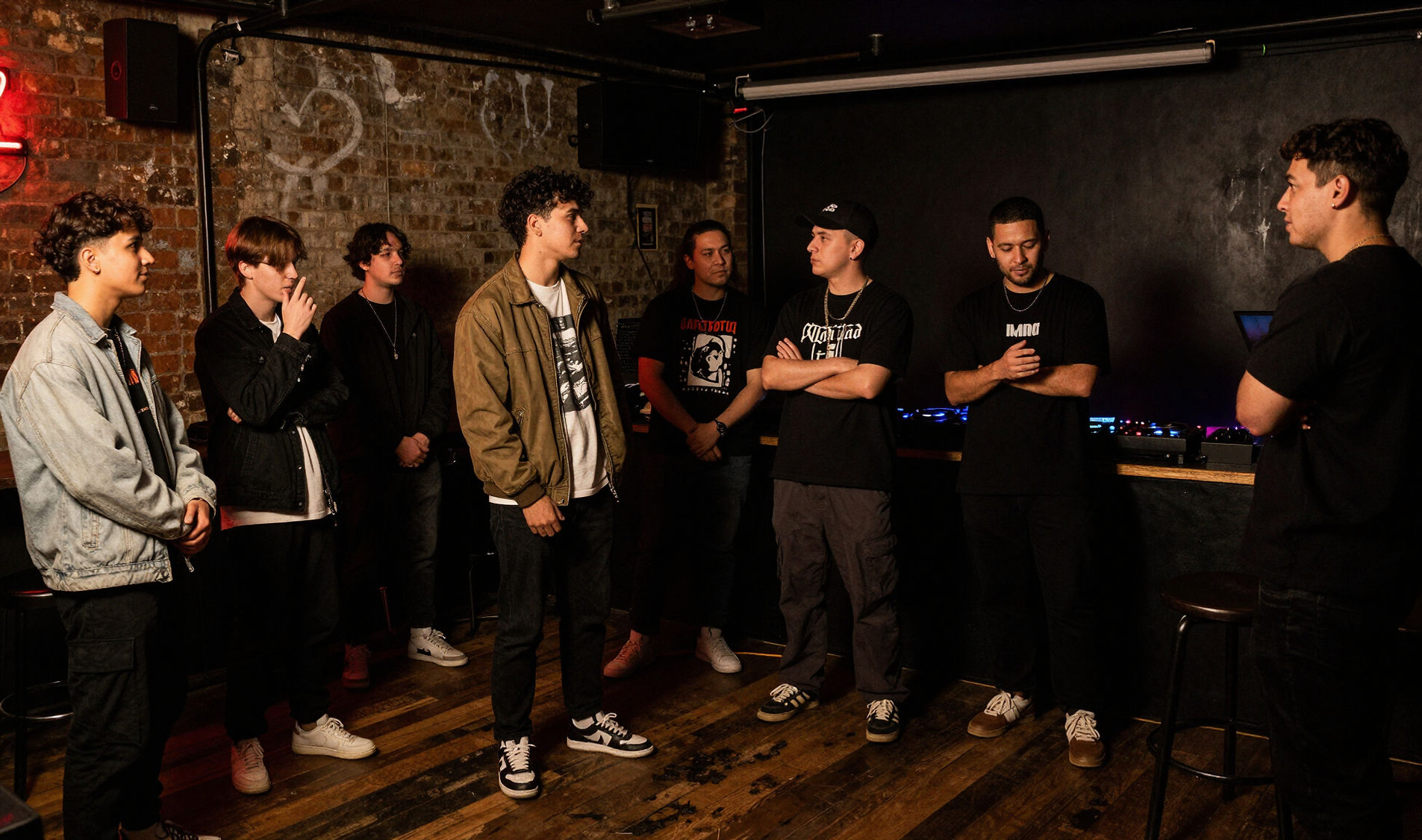 Group of people talking in a dimly lit Melbourne venue