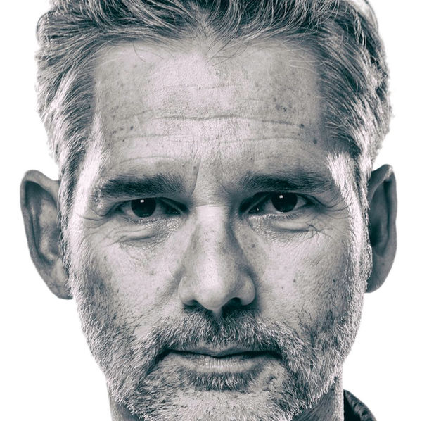 Close black and white portrait of a man looking straight to camera