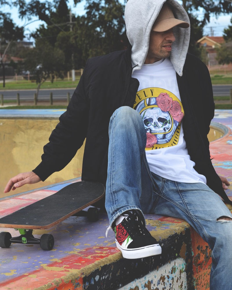 Two people in Spacely hooded tops at a skate spot