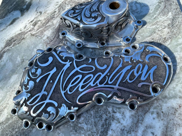 Engraved motorcycle part lettered 'I Need You' in blue