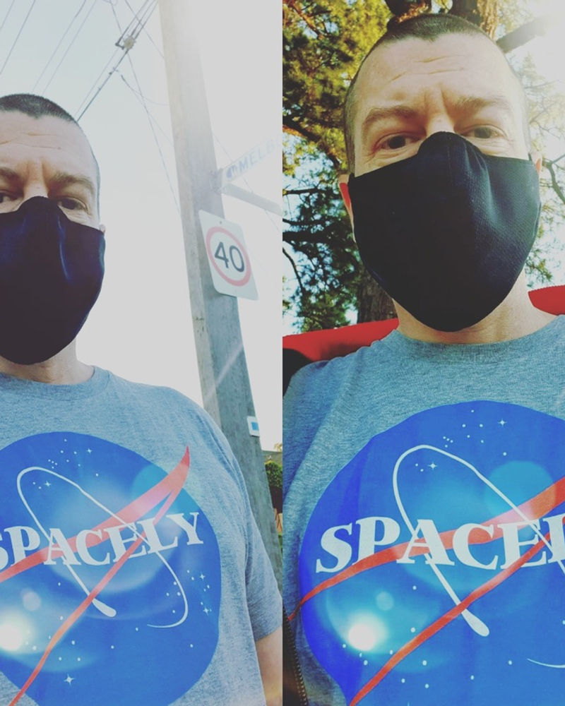 Two people in Spacely globe tees wearing black face masks