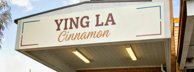Shopfront signage concept reading 'Ying La Cinnamon'