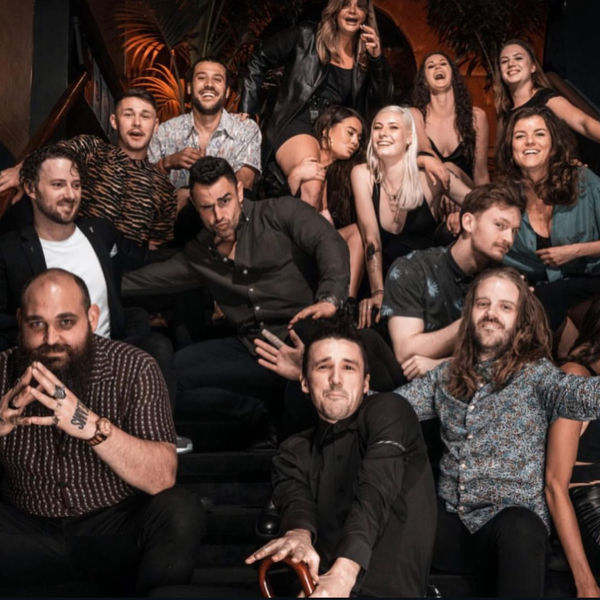 Group portrait of the Electric Bar team on the stairs