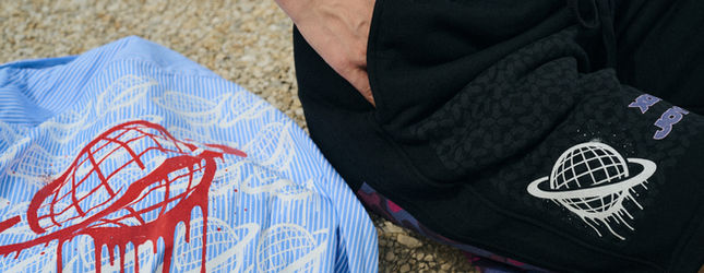 Spacely GEMINI 8 pieces laid out — blue globe tee and black hoodie