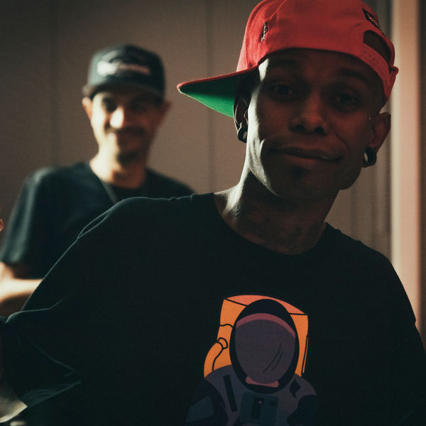 Portrait of an artist in a red cap and Spacely astronaut tee