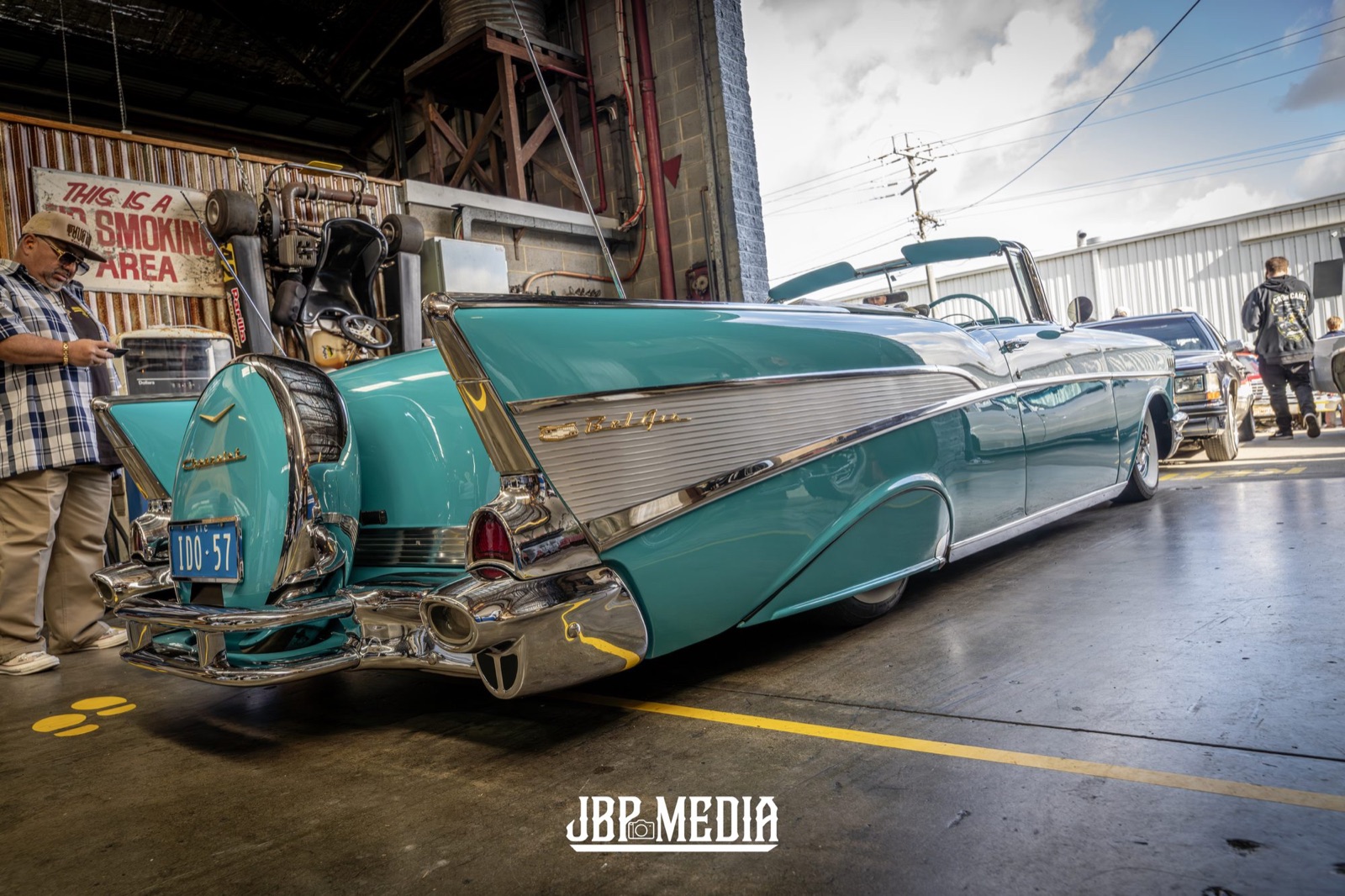 Turquoise 1959 Cadillac lowrider with tail fins inside the Open Hoist warehouse. Photo: JBP Media